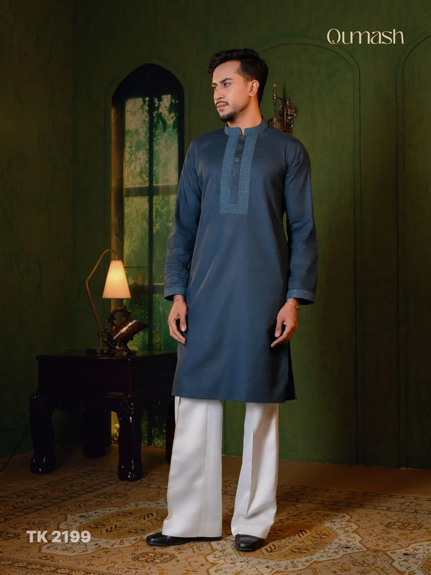 Man in a slate blue kurta with embroidered placket