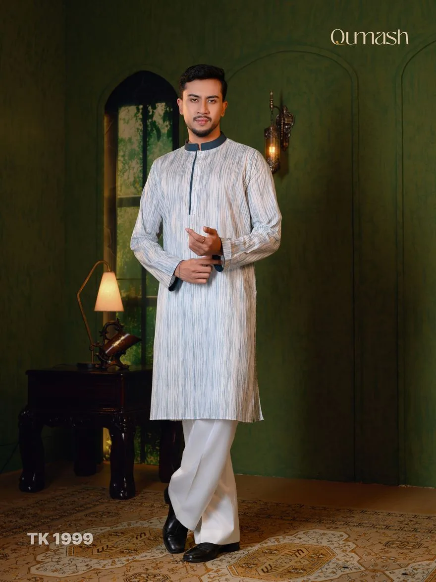 Man in an ivory striped panjabi with white trousers
