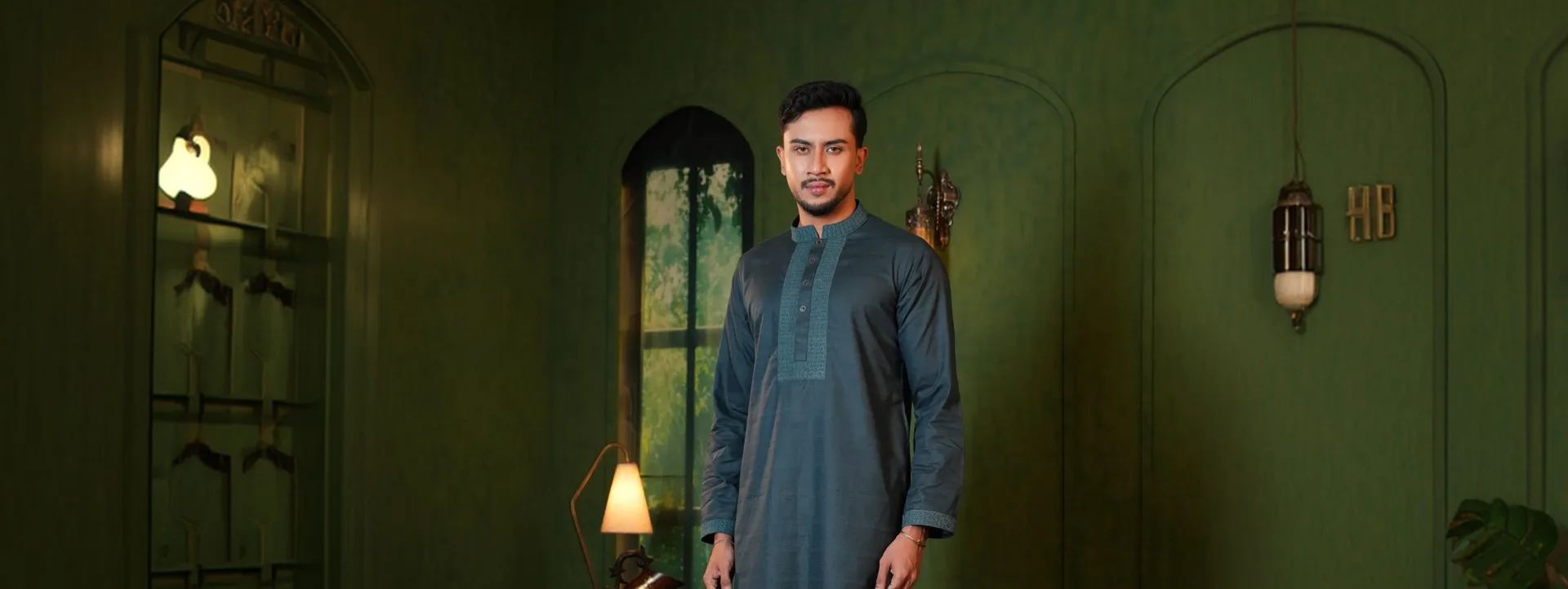 Man in a teal embroidered panjabi